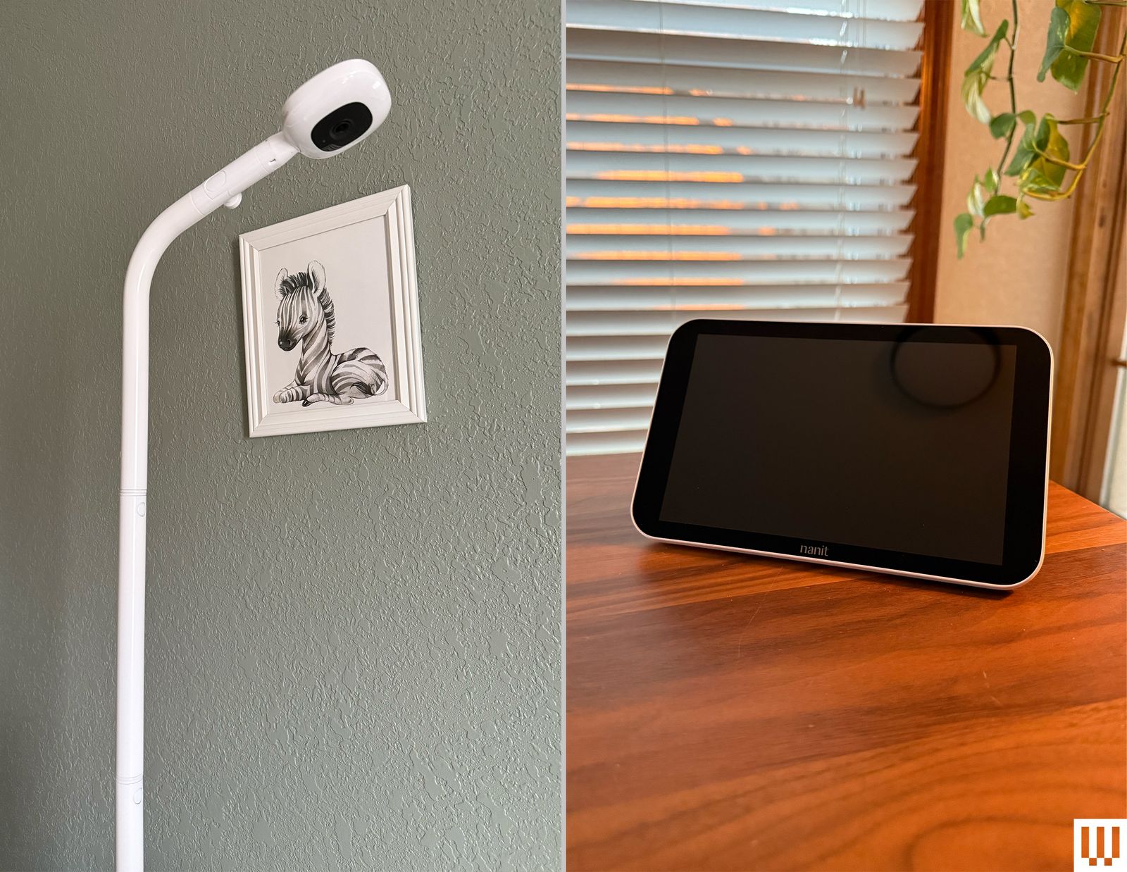 A narrow white pole with a camera on the end a small screen propped up on a wooden table