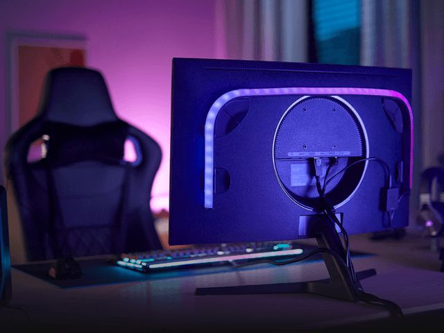 Philips Hue Light Strip attached to the back of a computer monitor