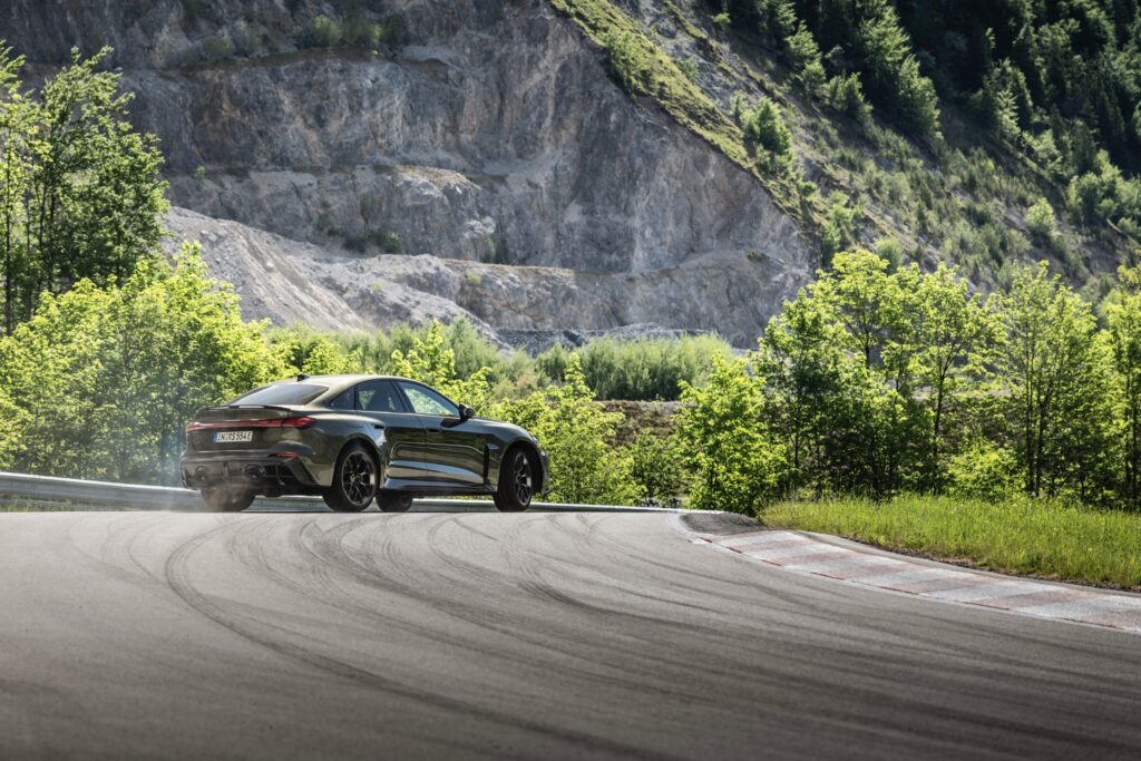 A green Audi RS5 on track