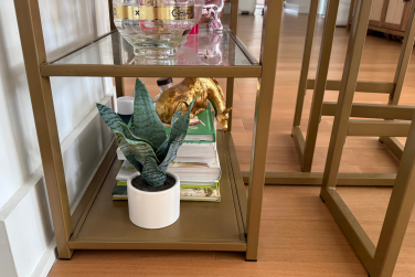 Shelf with decor and bar stools in kitchen area
