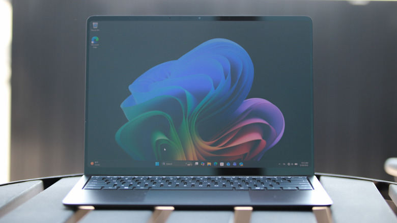 A Surface laptop on a table in the sun.