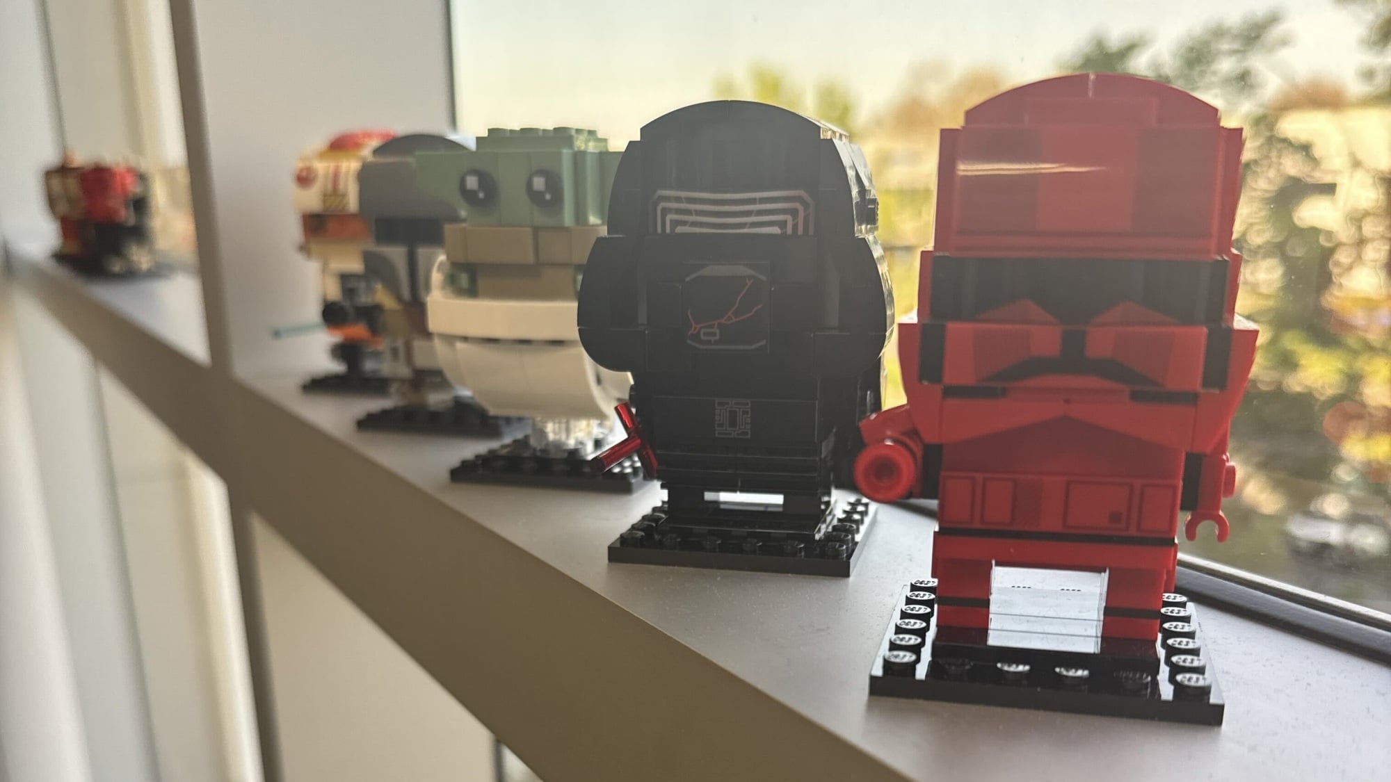 lego star wars brickheadz on office windowsill