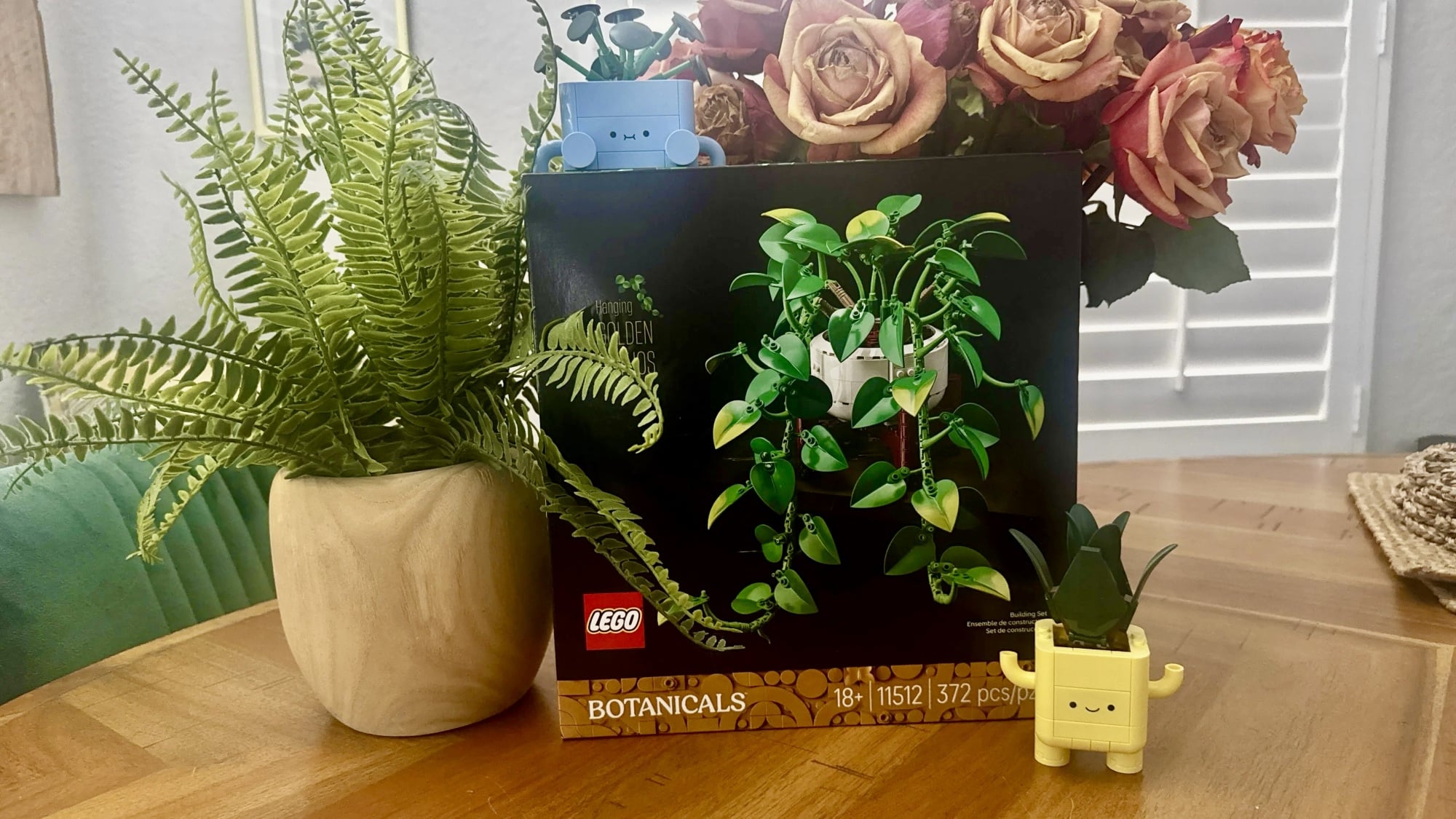 lego golden pothos set surrounded by plant and lego happy plants set