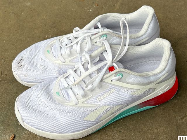 Reebok Nano X5, white running sneakers with bright teal and orange stripes on the heels